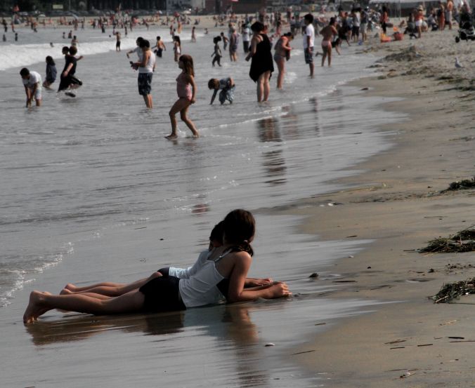 boston revere beach sand sculpting festival july 18 2014 girls laying on beach